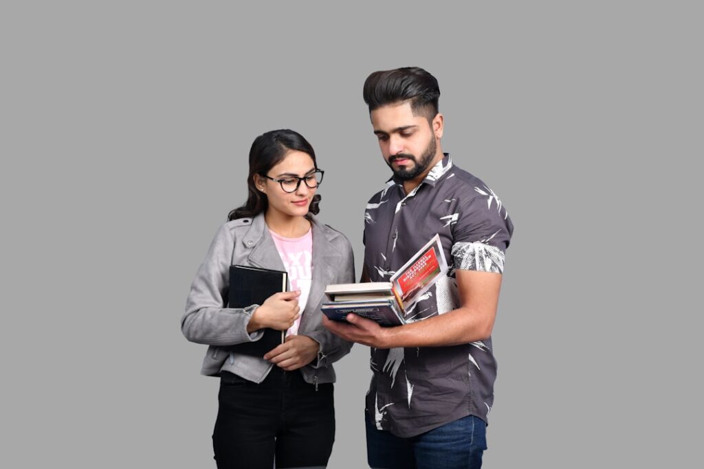 $50K Career Coaching for Students: Booming Industry Exposed a man and a woman looking at a book