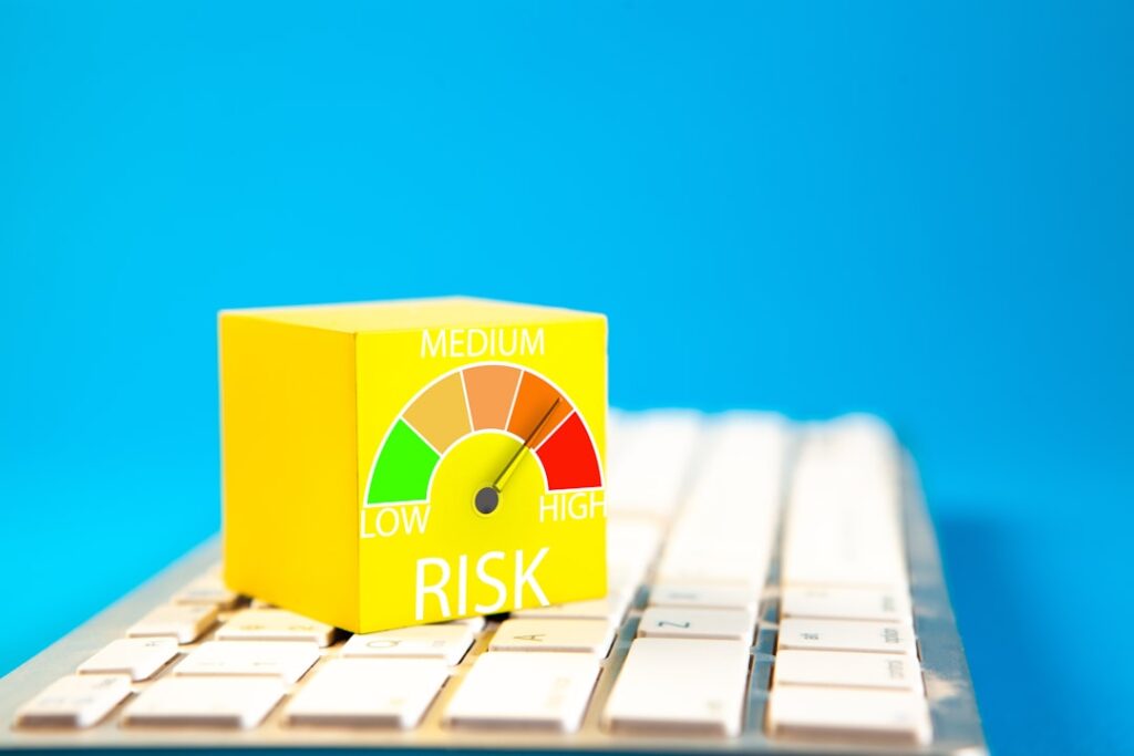 AI Data Liability: The Hidden Risk Threatening Your Business Yellow cube with risk meter on keyboard