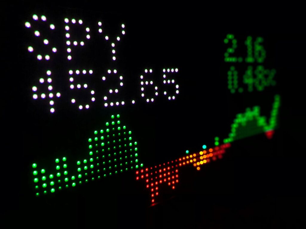 Bank of England Official Warns Stock Markets Overvalued a close up of a clock with different colored numbers
