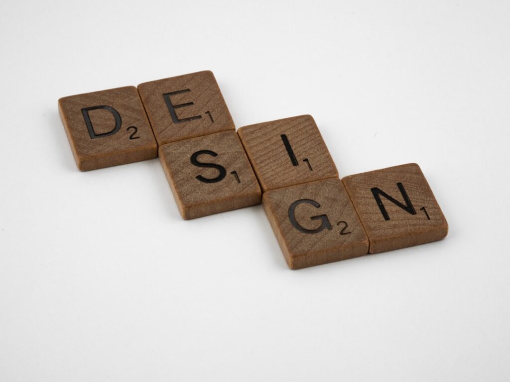 Anthropic CPO Exits Figma Board Amid Competing Product Plans brown wooden letter i letter