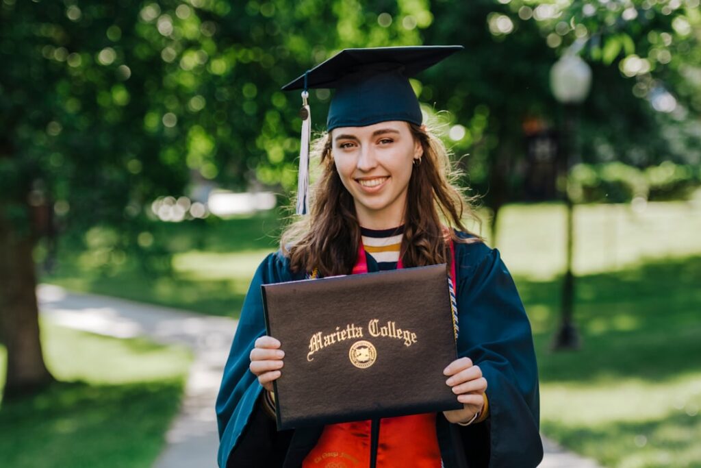Google and Microsoft Partner on $10K Elite College Degree woman in academic dress wearing academic hat