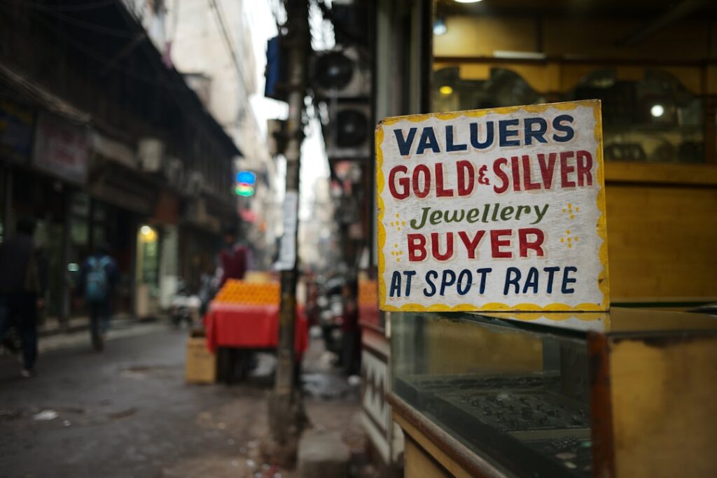 Gold and Silver Tumble as Market Sentiment Shifts red and yellow signage on street