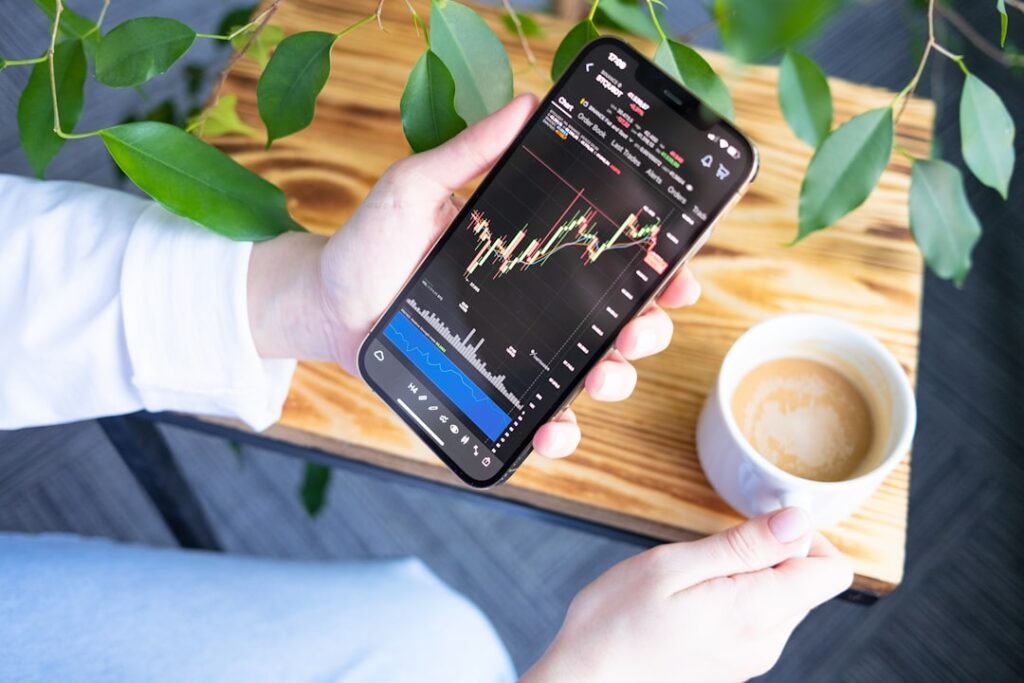 Safe Haven Currencies Surge on DeepSeek AI Disruption a person holding a cell phone in their hand