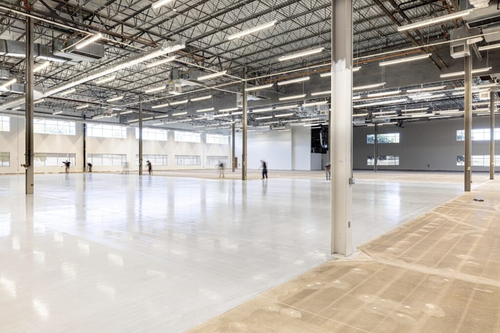 Maine Bans AI Data Centers: A Watershed Moment Empty, modern warehouse interior with polished concrete floor.