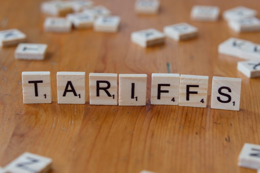 Tariff Refund Program Excludes Consumers Despite Higher Costs A wooden block spelling tarifs on a table