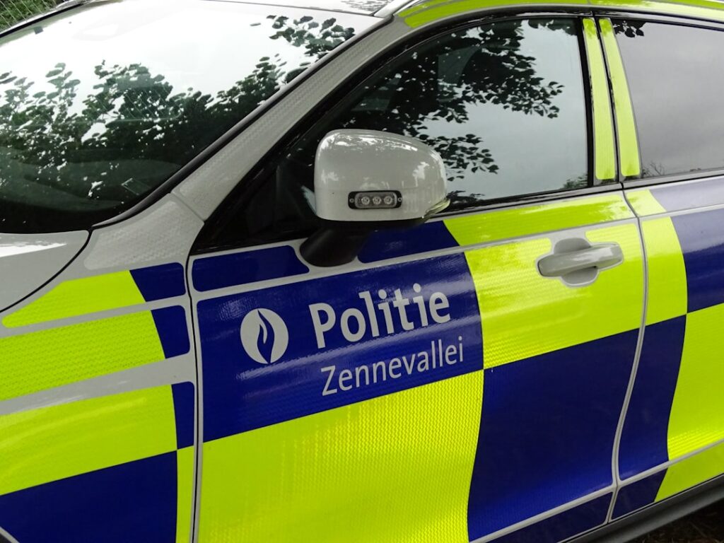 UK Uninsured Cars Hit 17-Year High at 160,000 Seizures Police car with blue and yellow checkered pattern