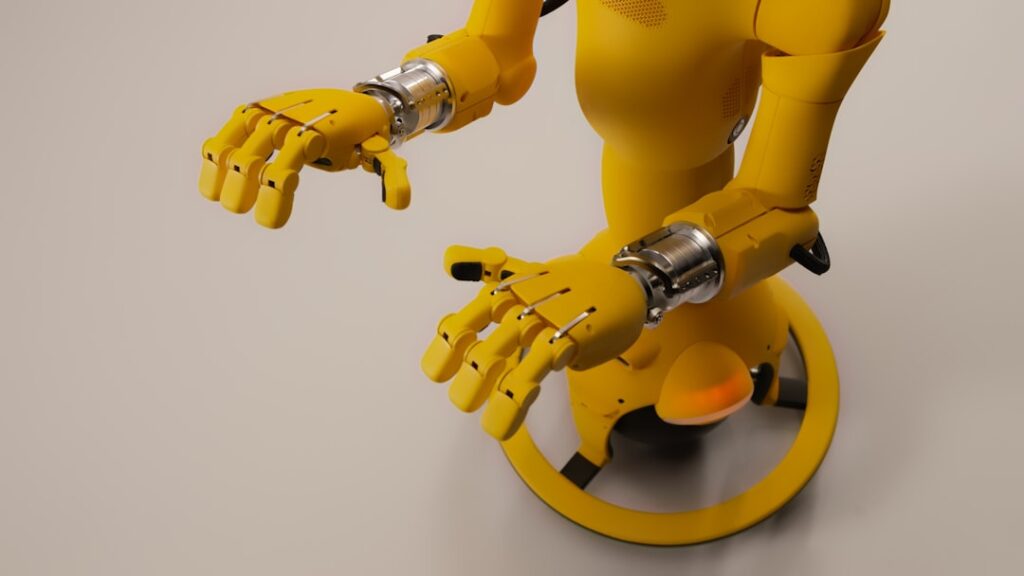 Chef Robotics Defies Robot Kitchen Graveyard Odds Yellow robot with articulated hands on a white background