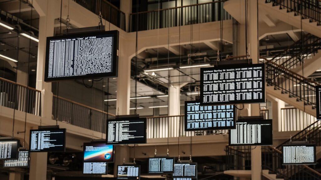 Protecting Your Data While Using AI Chatbots Safely a bunch of television screens hanging from the ceiling