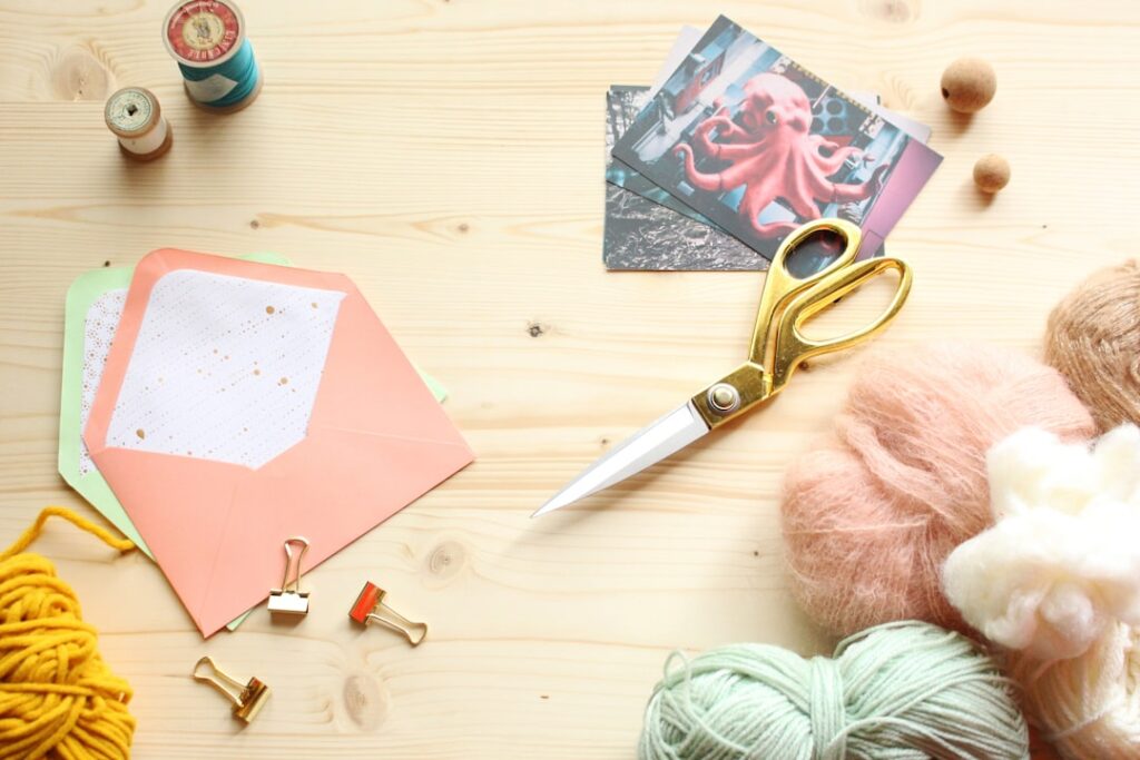 Budget-Friendly Crafting Supplies: 7 Smart Shopping Destinations silver scissors on pink paper