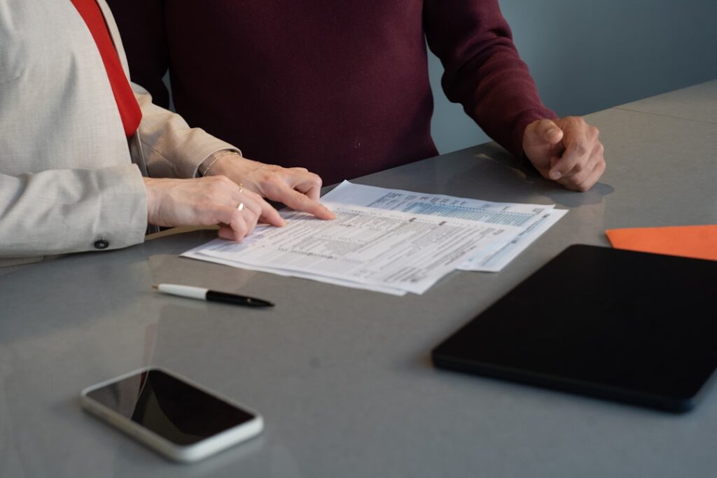 Small Business Tax Season: Your Essential Filing Checklist Two people reviewing documents at a table.