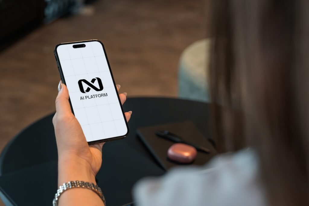 Smart AI Investment: Maximizing Returns Without Overspending Person holding a smartphone with a logo on screen.