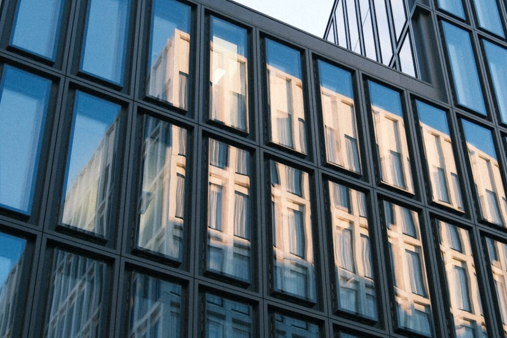 Ontinue Expands Europe With New Zurich Headquarters Modern building facade with glass reflections