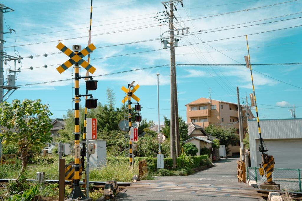 $22.45M Verdict Against Kansas City Southern Railway Railroad crossing with barriers and warning signs