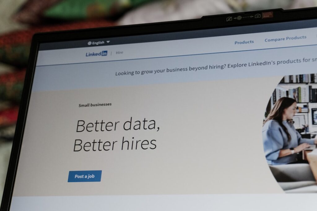 Small Business Hiring Slows as Labor Crisis Persists Linkedin website displaying 'better data, better hires' slogan.