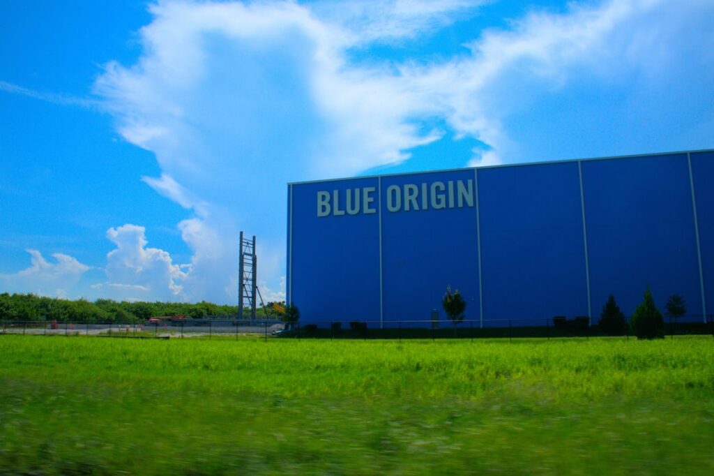 Blue Origin Grounds Rocket After Satellite Launch Failure a large blue building with a sign on it