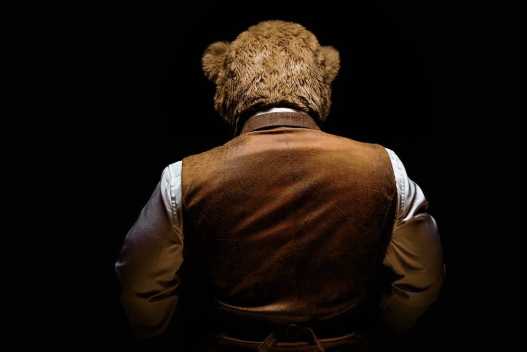 California Trio Busted for $141K Insurance Fraud Bear Suit Scheme the back of a man wearing a brown leather vest