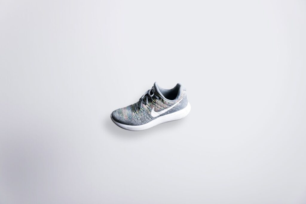 Adidas' Featherweight Running Shoe Redefines Performance unpaired gray and white Nike Flyknit shoe