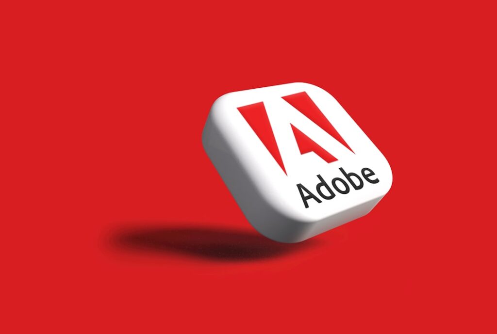 Adobe's AI Revolution: Small Business Game-Changer the adobe logo on a red background