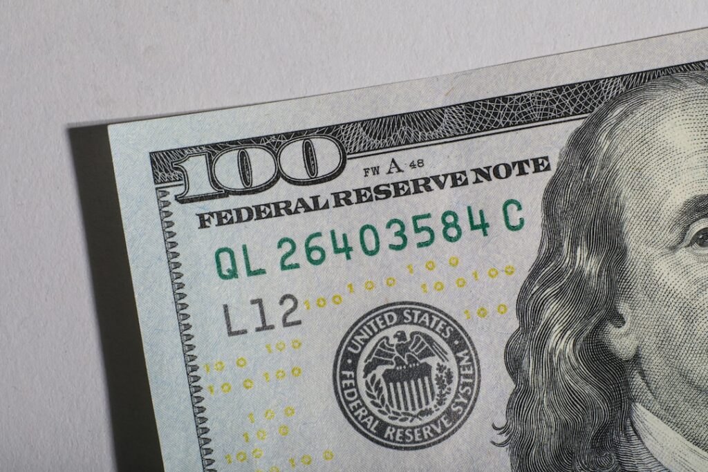 Warsh Fed Hearing: Trump Deal Denial, Policy Overhaul Push Close-up of a one hundred dollar bill