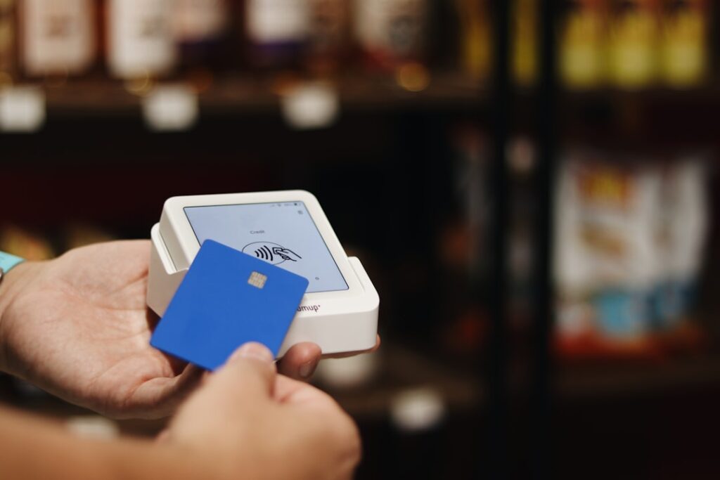 Reward Card Software: Complete Guide for Businesses A person holding a blue and white box in their hand