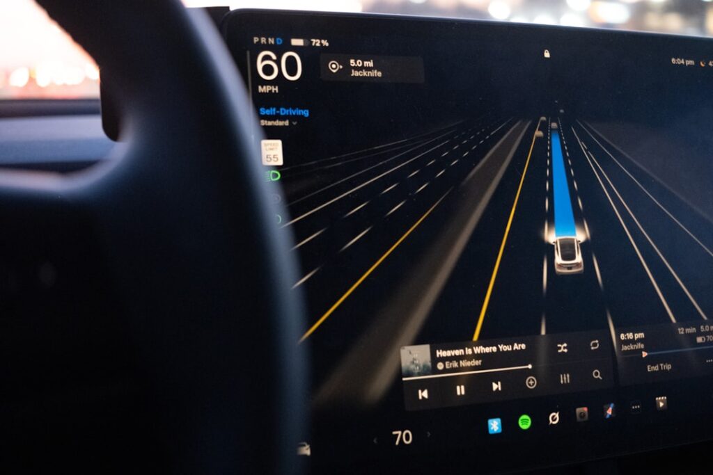 Tesla's Hardware Upgrade Reality Check Reshapes FSD Promises Car dashboard displaying autonomous driving interface