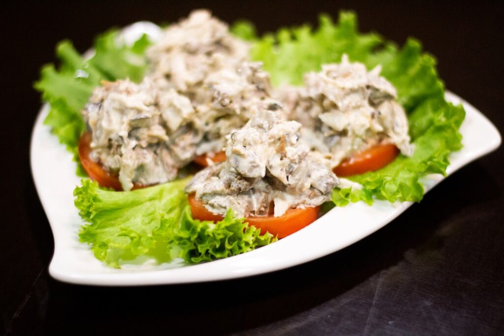 Chicken Salad Chick Franchise Explodes With 50% Growth vegetable salad on white ceramic plate
