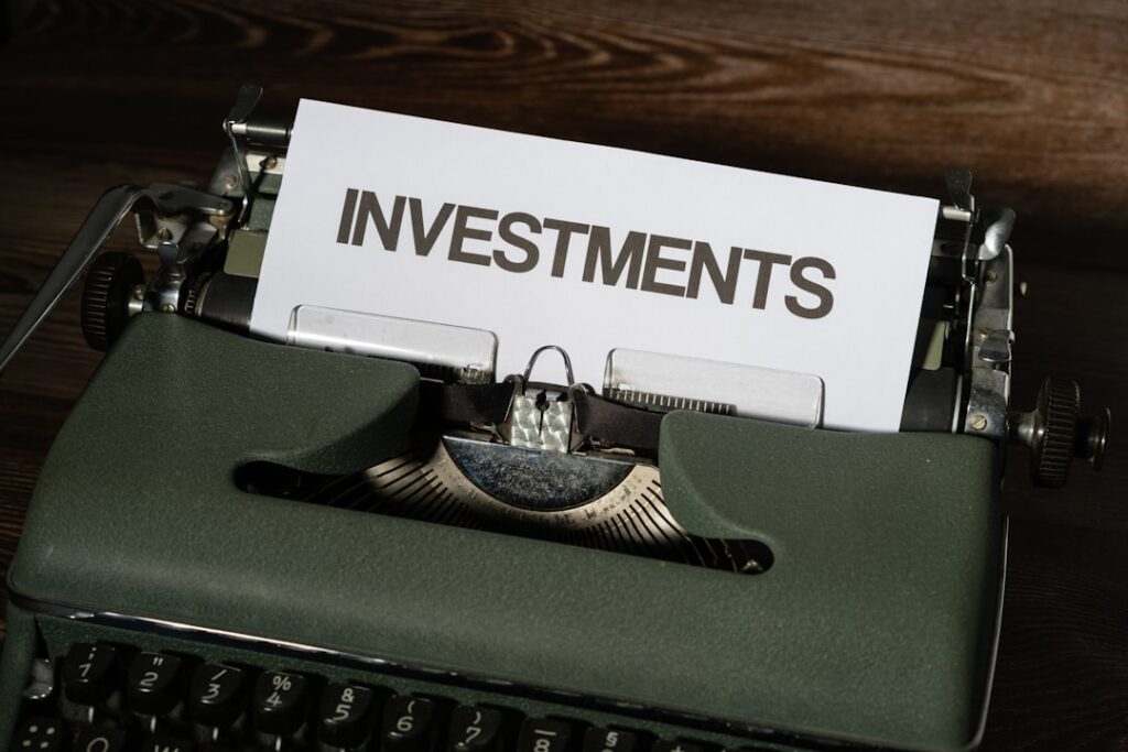 Top Franchise Portals: Your Investment Guide a close up of a typewriter with a paper that reads investments