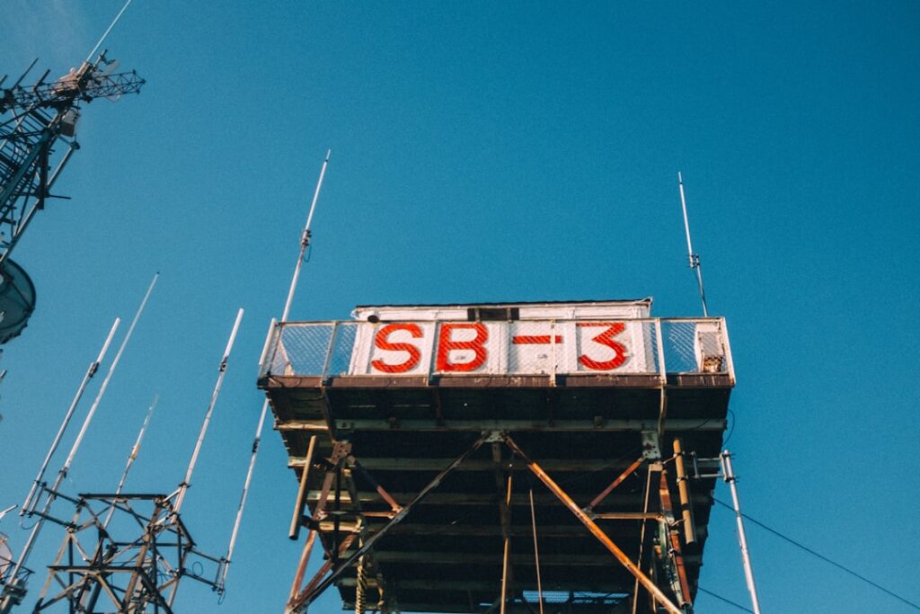 S Corporation Tax Benefits & Structure Explained A radio tower marked "sb-3" stands against the sky.