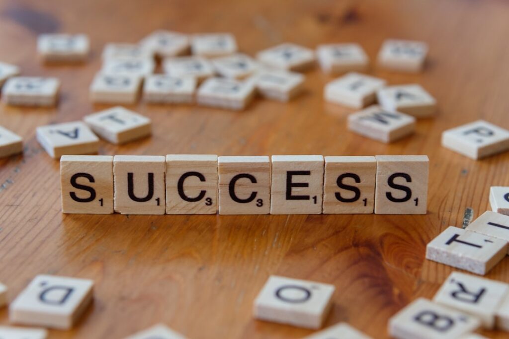 Building Winning Franchise Models: Essential Success Factors Scrabble tiles spelling out the word success on a wooden table