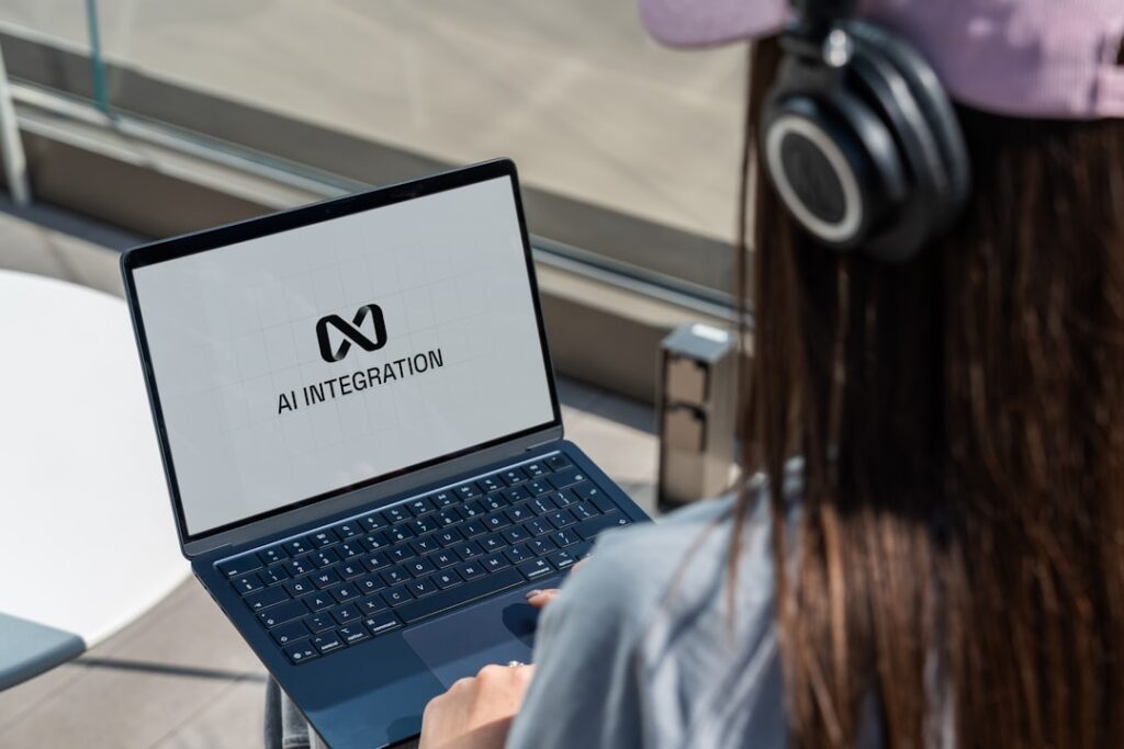 Nothing's AI Dictation Tool Supports 100+ Languages Person using laptop with ai integration logo displayed.