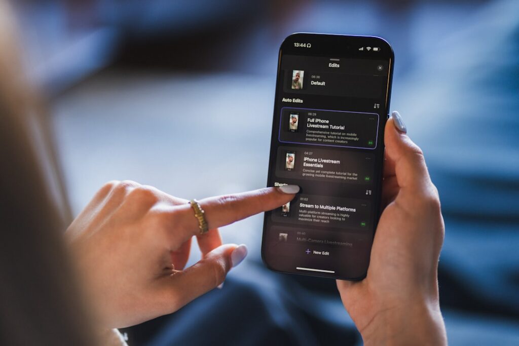 ComfyUI Reaches $500M Valuation on Creator Control Push Person using a smartphone with a list on the screen