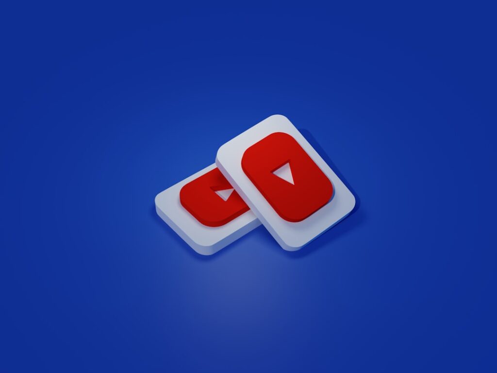 Free Tool Transforms YouTube Into a Discovery Machine a pair of white and red play buttons on a blue background