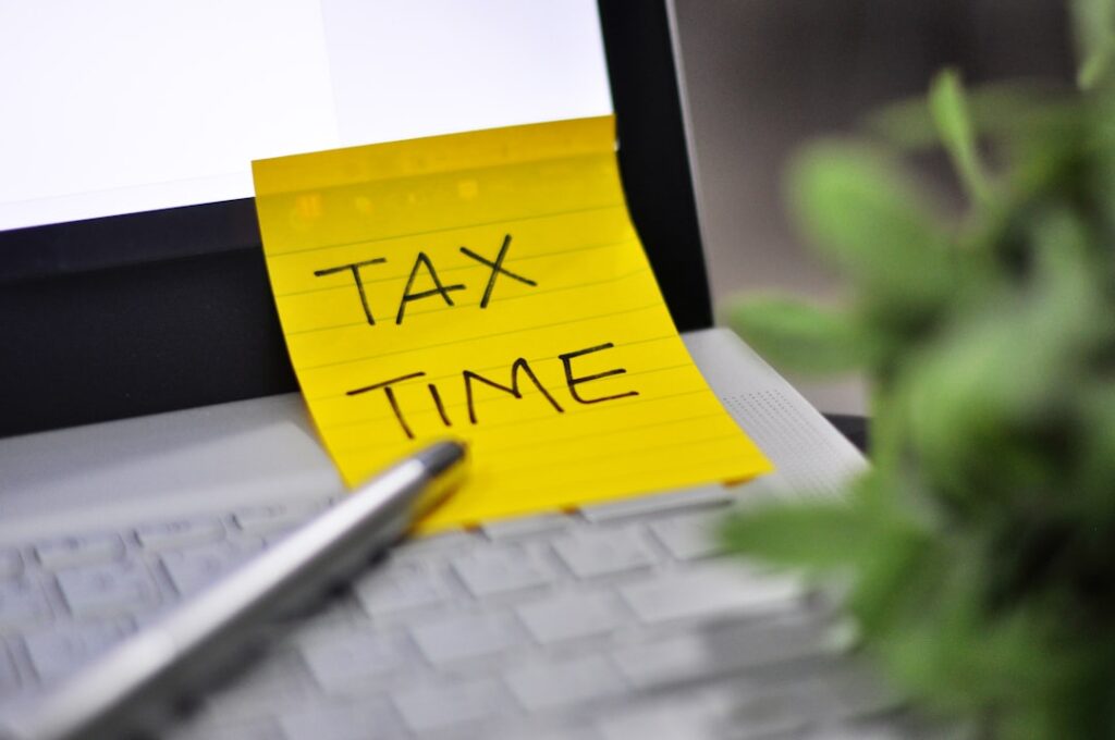 5 Tax Deductions Small Business Owners Can't Ignore Yellow sticky note with tax time written on it.