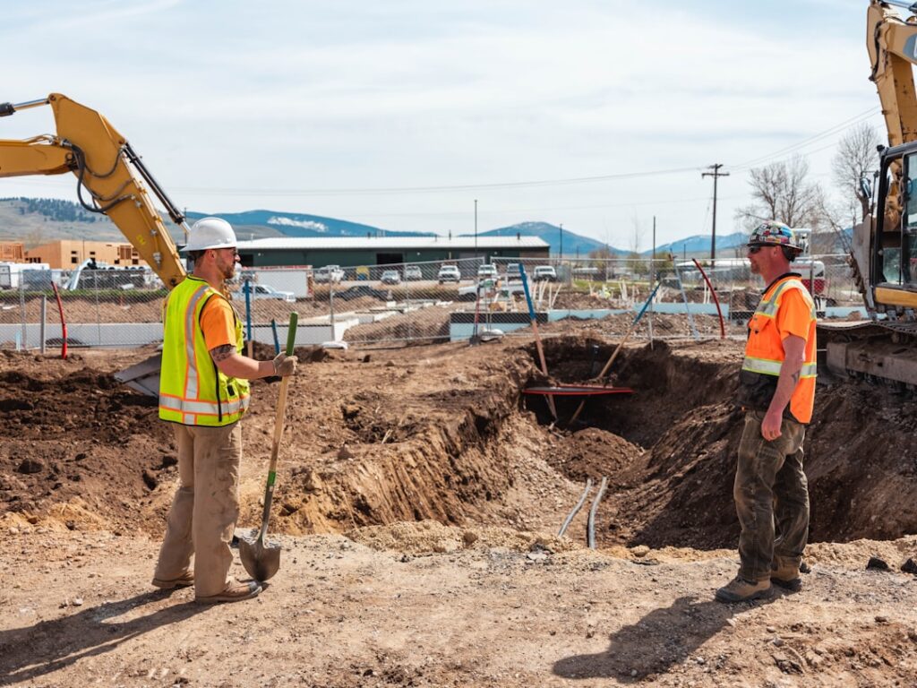 Utility Potholing: Construction's Secret Safety Weapon men in safety vests working on a construction site