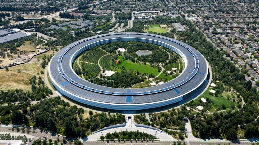 Apple's Masterful CEO Transition: Cook Hands Off to Ternus An aerial view of a circular building in a city
