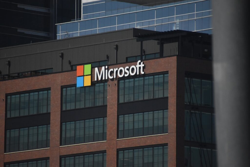 Break Free from Office Subscriptions: $33 Lifetime License A tall building with a microsoft logo on top of it