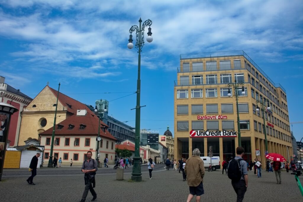Building Business Credit: Your Complete Roadmap People walking on a city square with buildings.