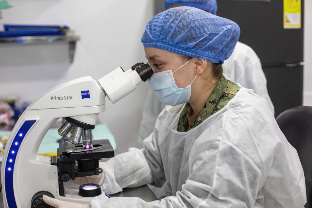 Building Healthcare Innovation: FIFARMA's Blueprint for Latin America Scientist looks through a microscope in a laboratory.