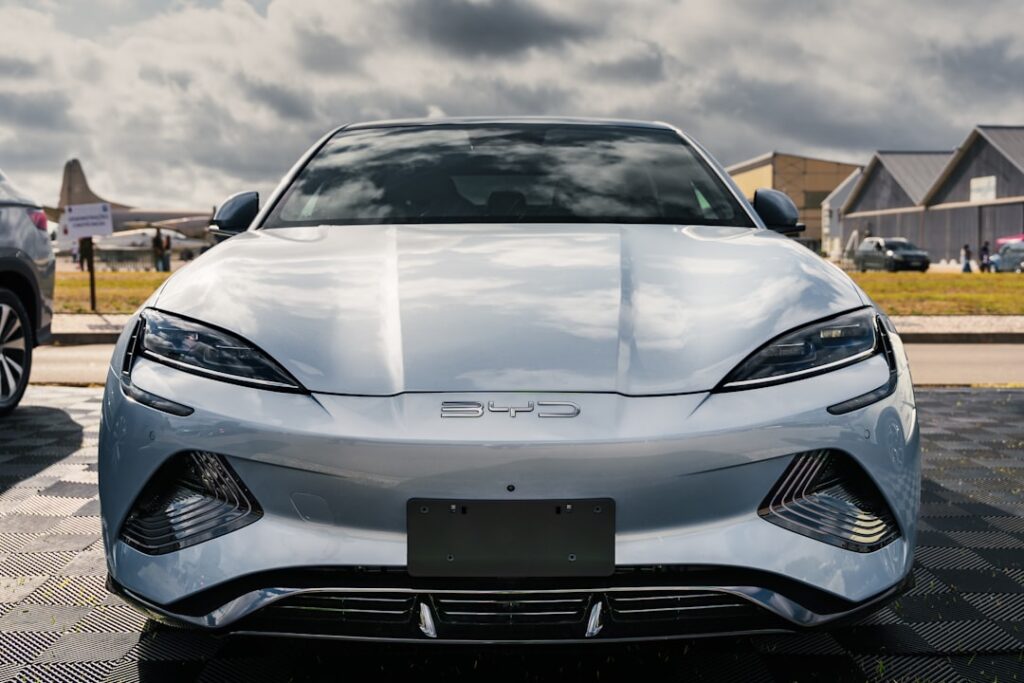 BYD Charts Independent Path as EV Shift Accelerates A silver sports car parked in a parking lot