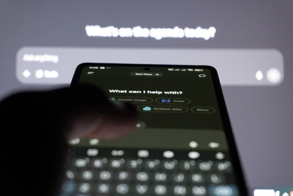 ChatGPT Images 2.0 Excels at Text Generation in Images Person typing on smartphone with ai chatbot on screen.