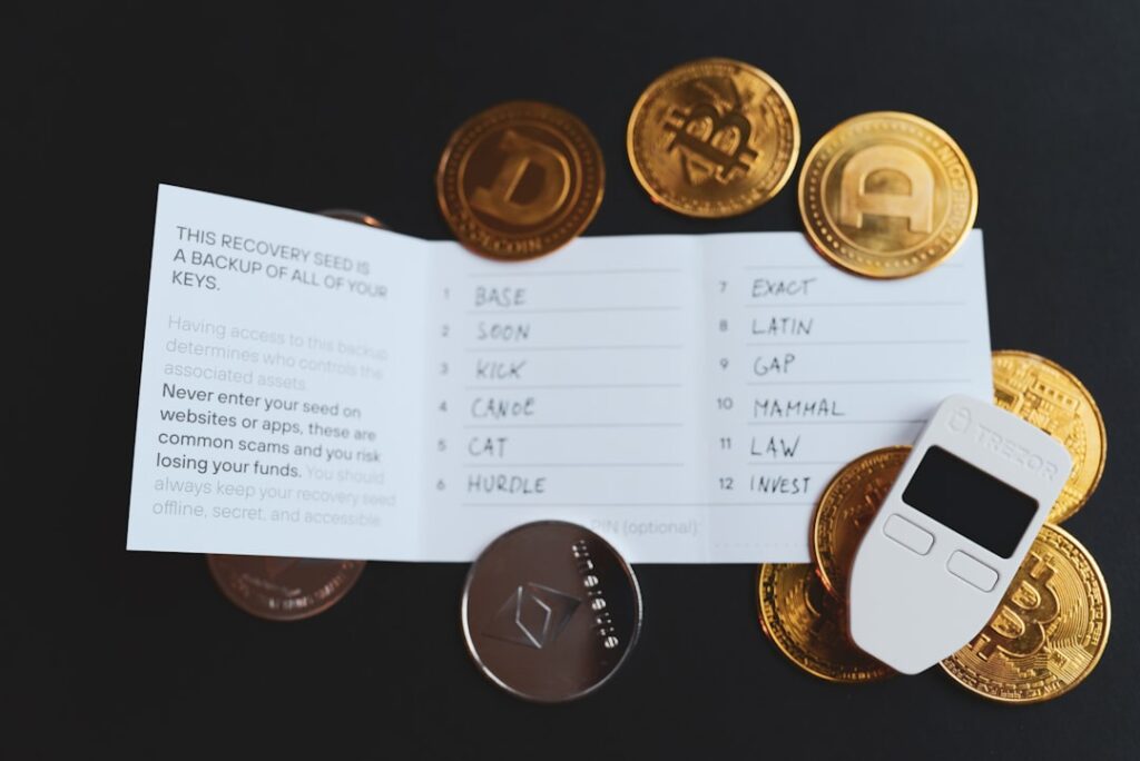 Dynamite Wallet Uses Facial Recognition as Crypto Private Key a cell phone sitting on top of a pile of coins