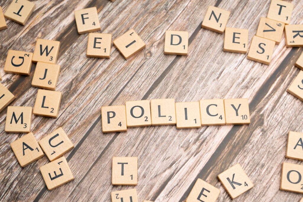 Federal Labor Laws: Your Complete Workplace Rights Guide scrabble tiles spelling policy on a wooden table