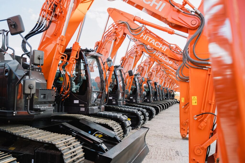 Hard Money Equipment Loans: Fast Funding Without Perfect Credit A row of orange and black machines sitting next to each other
