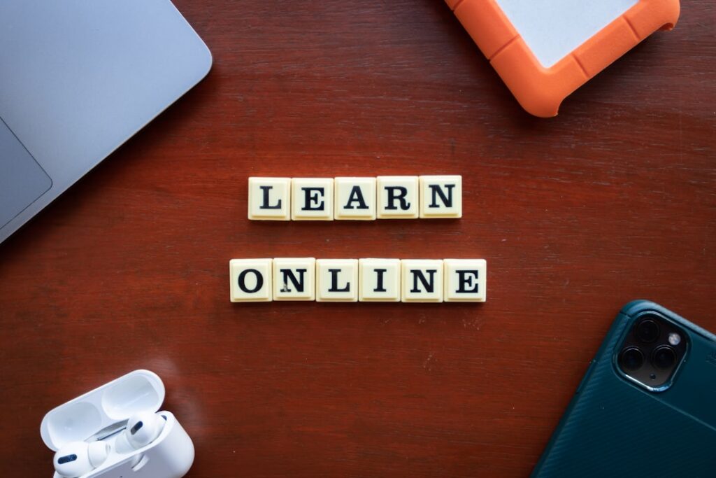 Lifetime Access to 1,000+ Pro Courses for $19.97 a wooden table with scrabble tiles spelling learn online