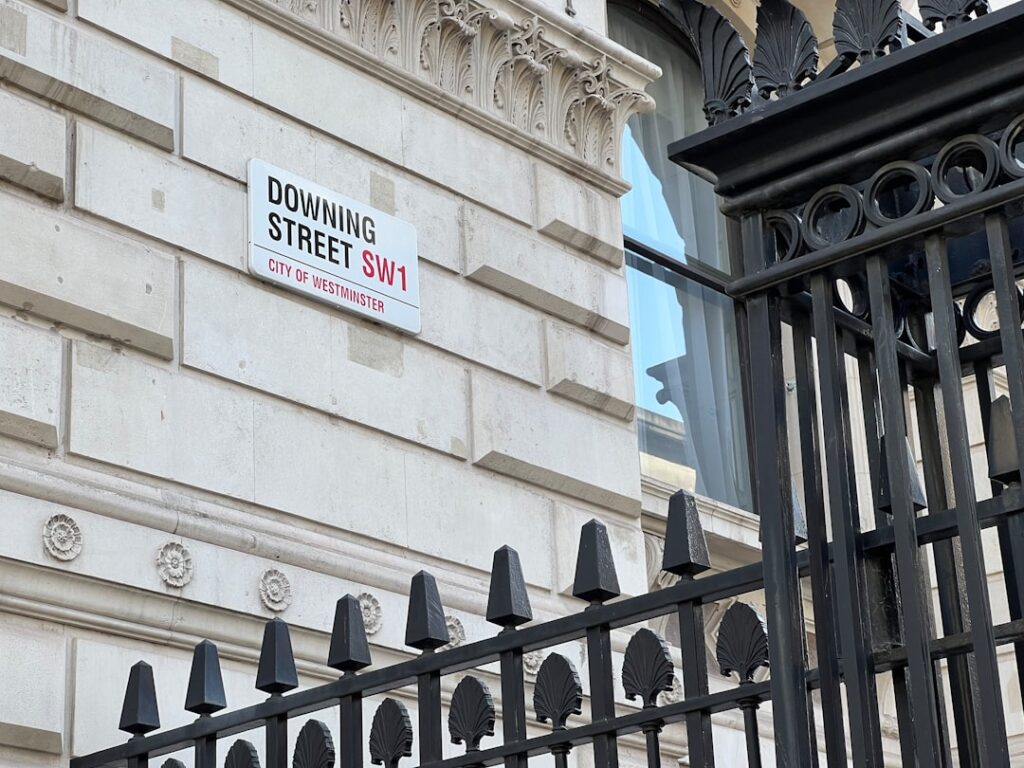 London Rent Crisis Pushes Young Workers to Manchester a building with a sign on the side of it
