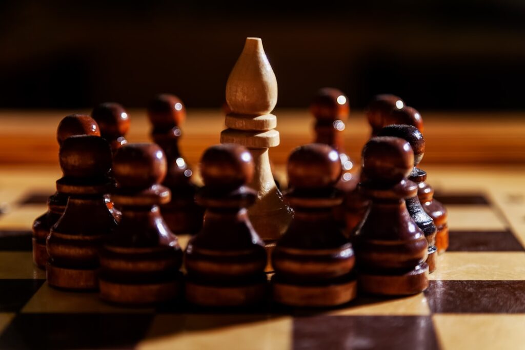 Market Downturns: Your Competitive Advantage Window A bishop is surrounded by pawns on a chessboard.