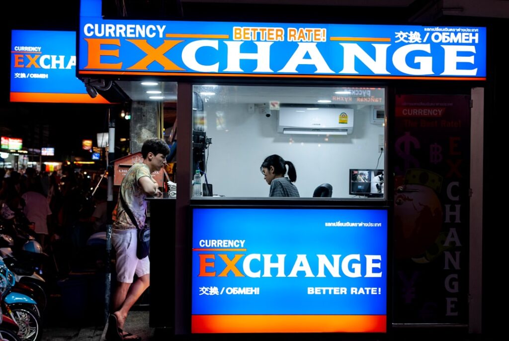 Mediterranean Energy Firms Extend Debt Exchange Offer man in gray short standing near counter of currency exchange