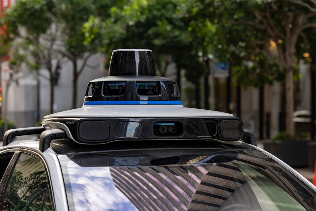 Neusoft Drives Innovation at Auto China 2026 Self-driving car with sensors on city street