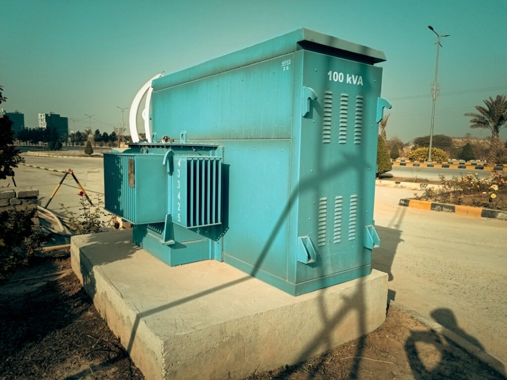 Phase Converter Sizing Guide: Expert Advice a large blue box sitting on the side of a road