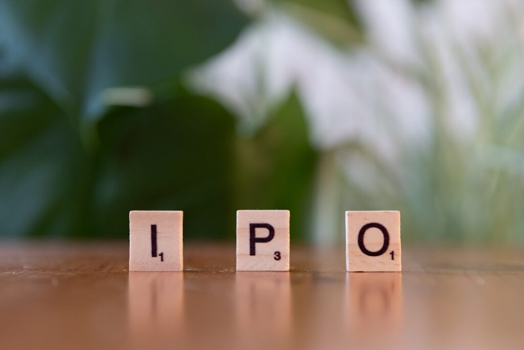 Plutonian Acquisition Corp II Prices $100M IPO A wooden block spelling the word ipo on a table